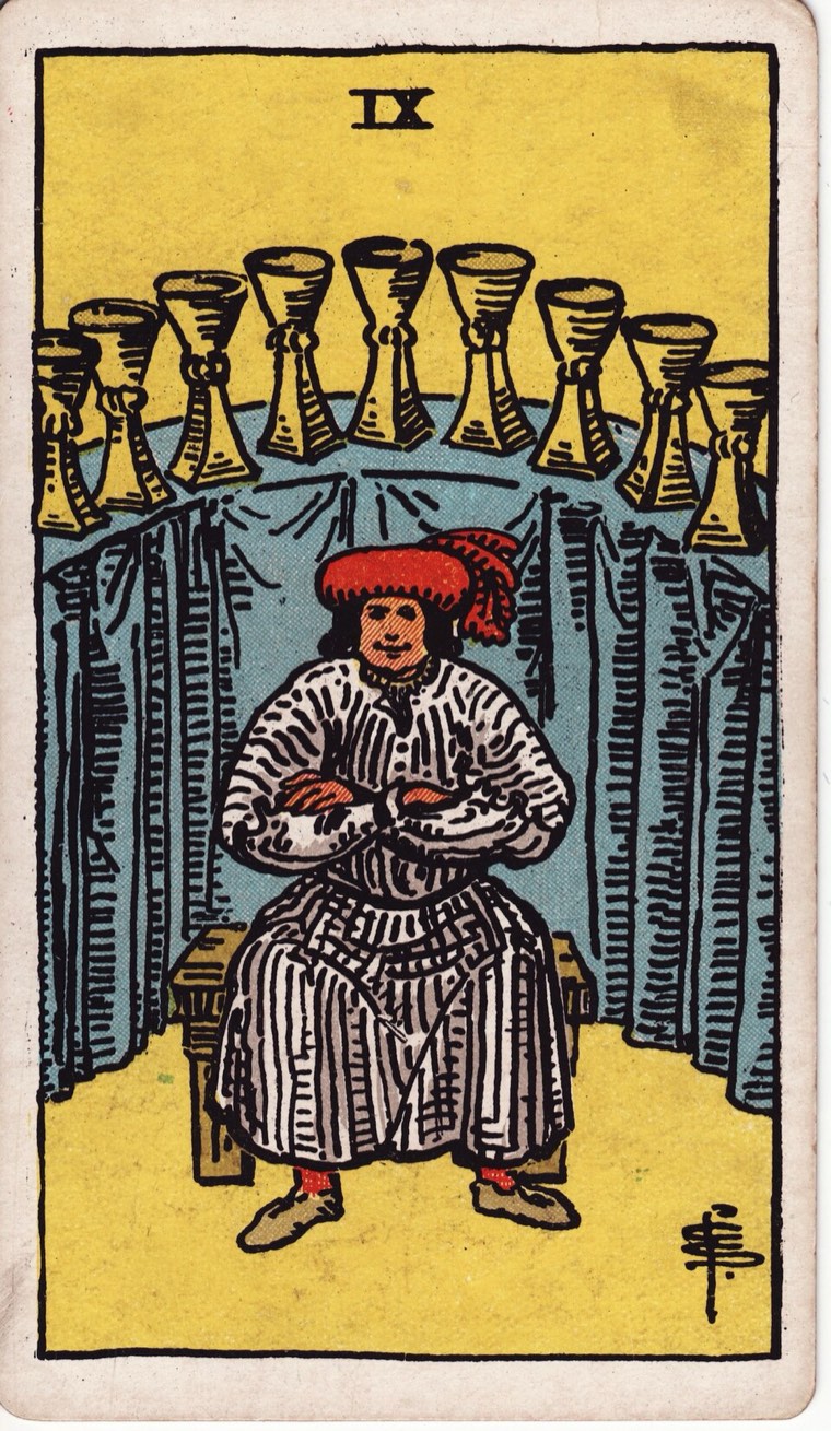 Nine of Cups in the Waite–Smith 1909 deck: satisfied seated or grounded figure, display of nine cups, sense of earned pleasure