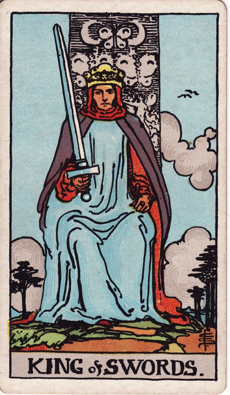 King of Swords in the Waite–Smith 1909 deck: frontal intellectual authority, one upright sword, balanced composed environment