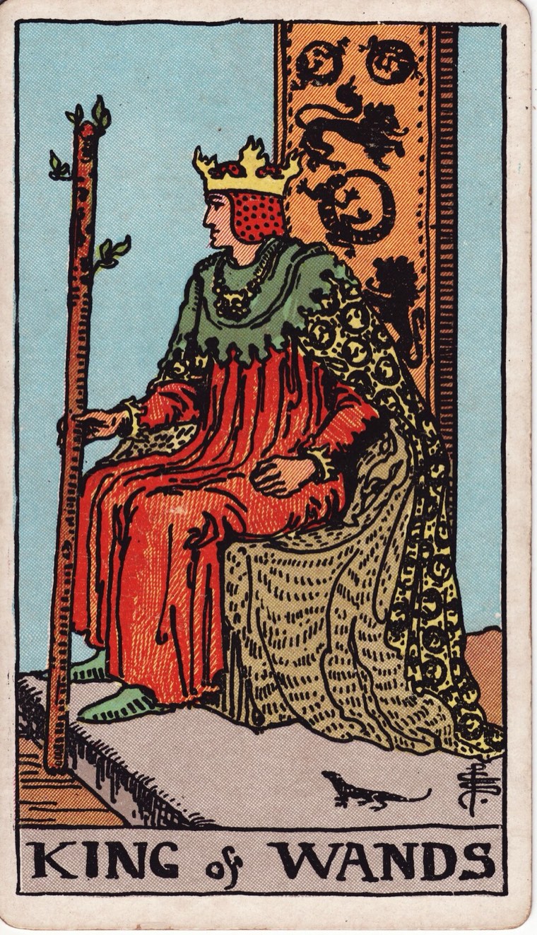 King of Wands in the Waite–Smith 1909 deck: active visionary authority, one wand, contained fire imagery, forward readiness
